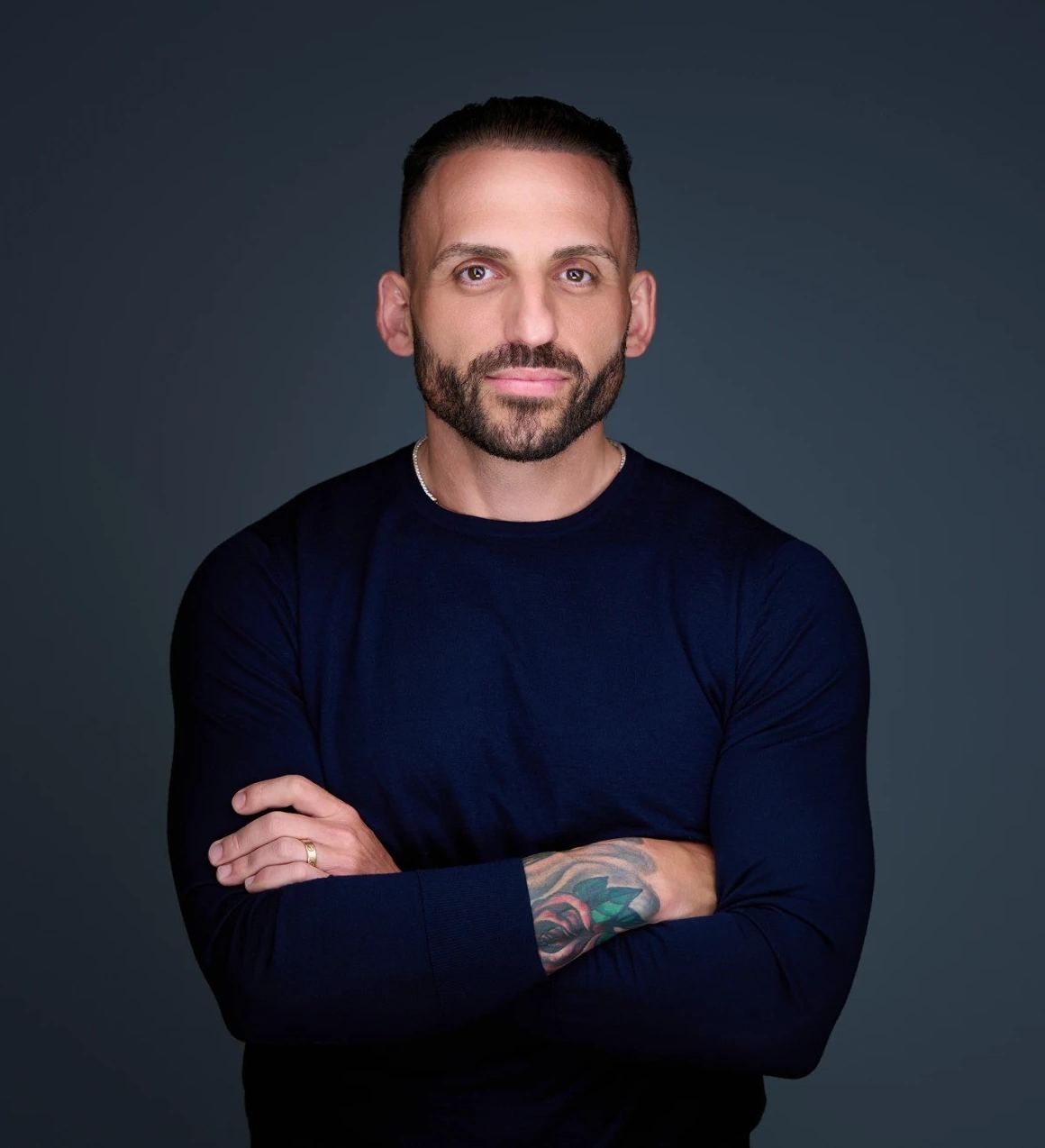 Dom Iacovone, arms crossed